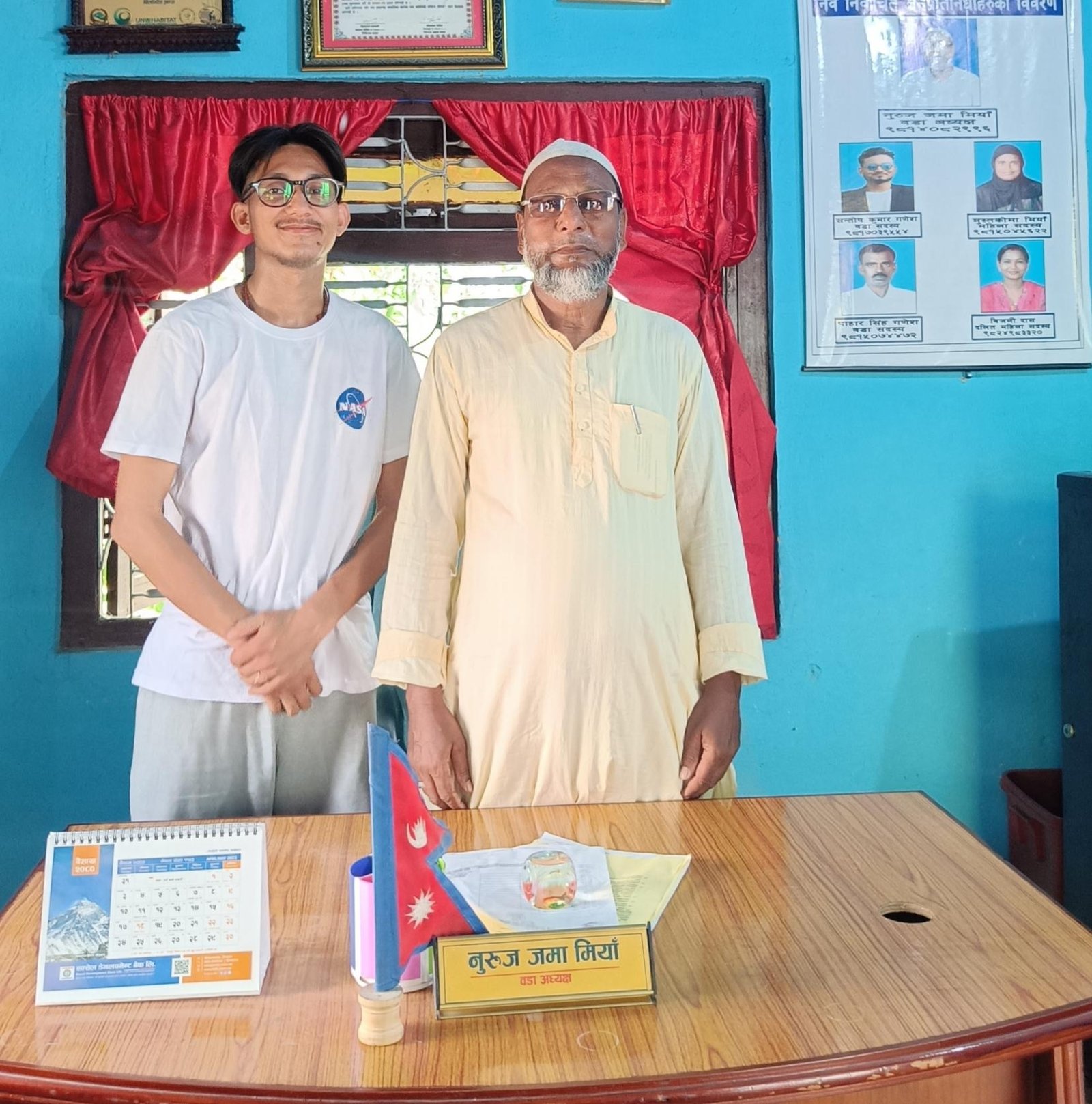 Director meets chairman of kanchankawal VDC for screening event